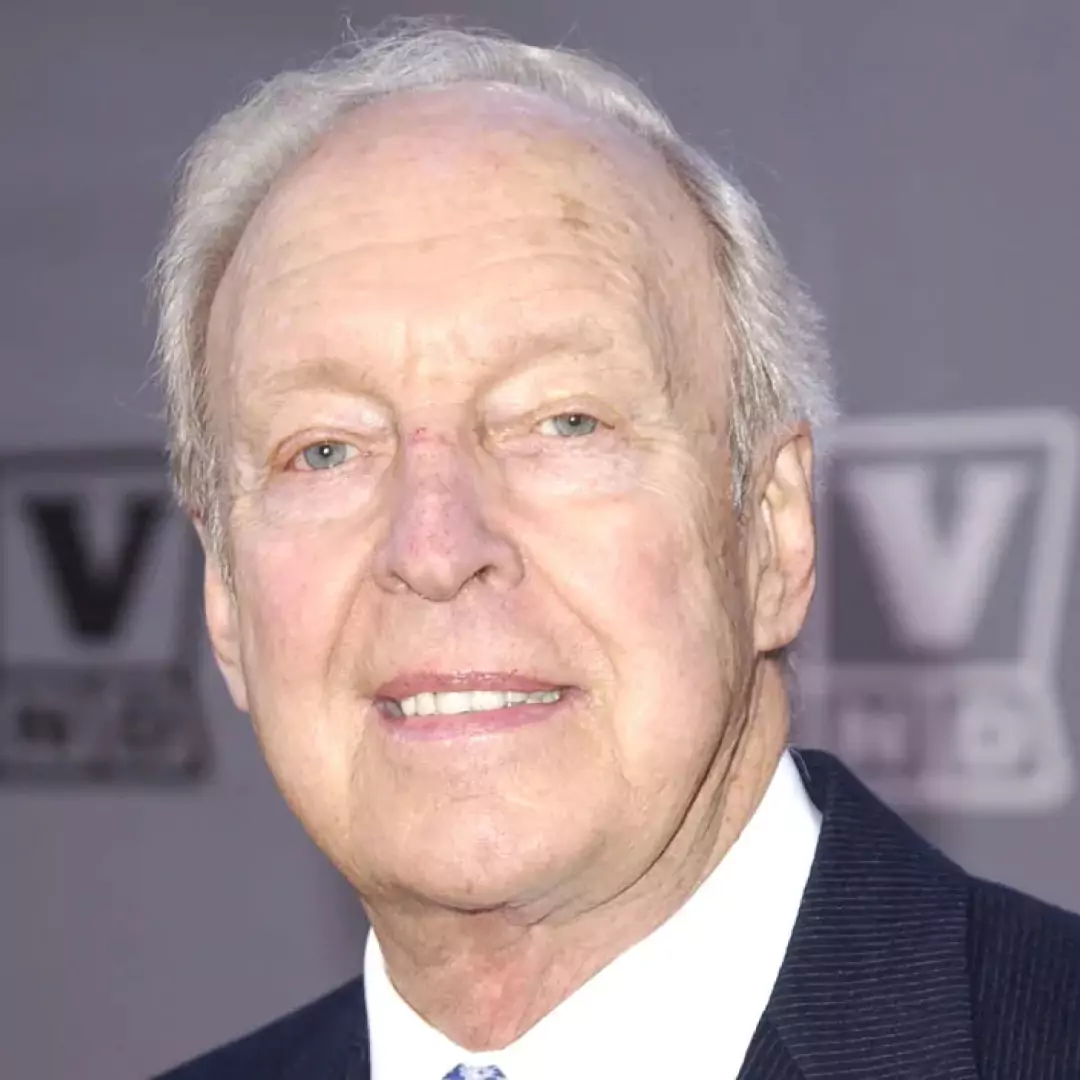 Conrad Bain smiling at a public event, highlighting his career as an actor known for 'Diff’rent Strokes' and 'Maude'