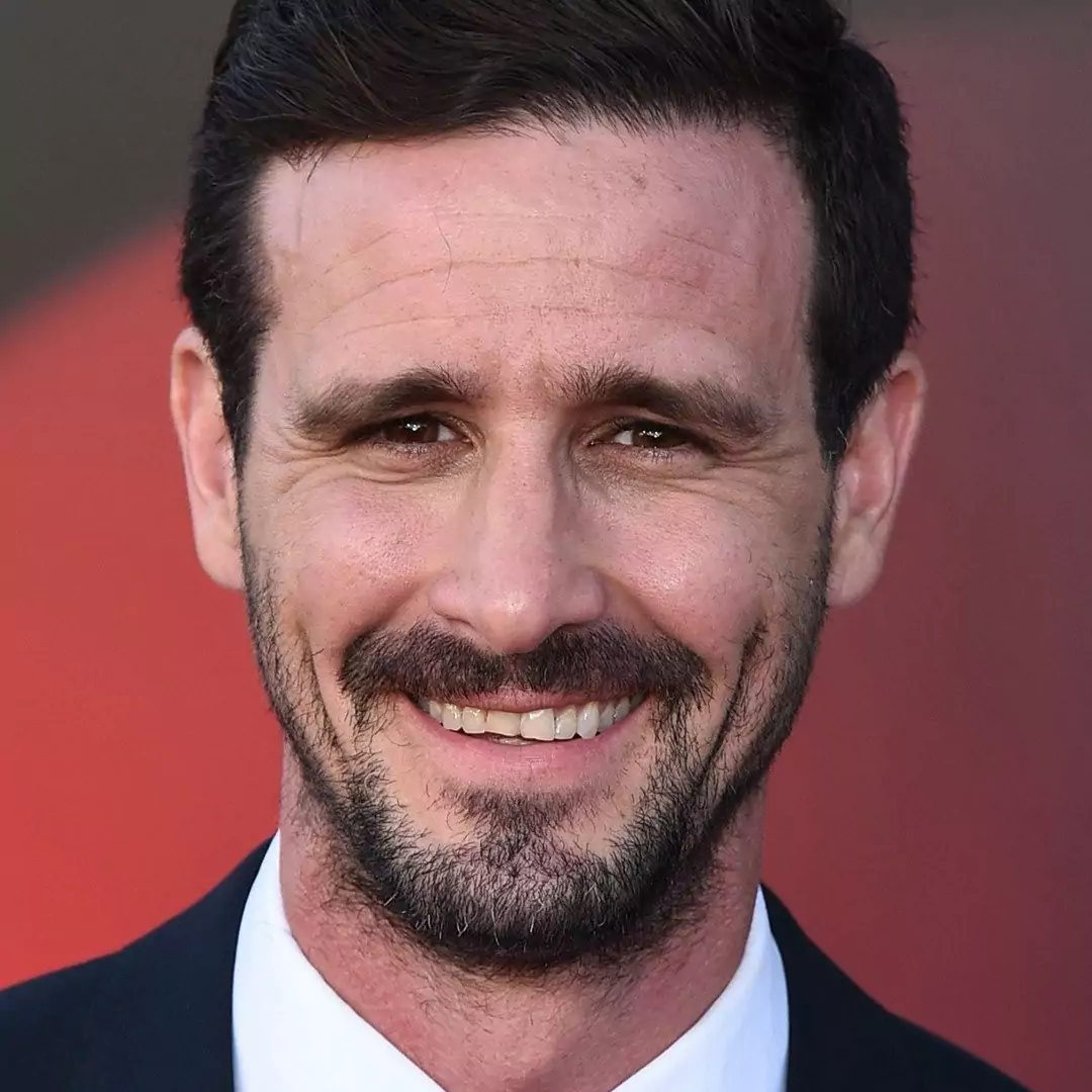 James Ransone smiling at a red carpet event, highlighting his career as an actor and musician