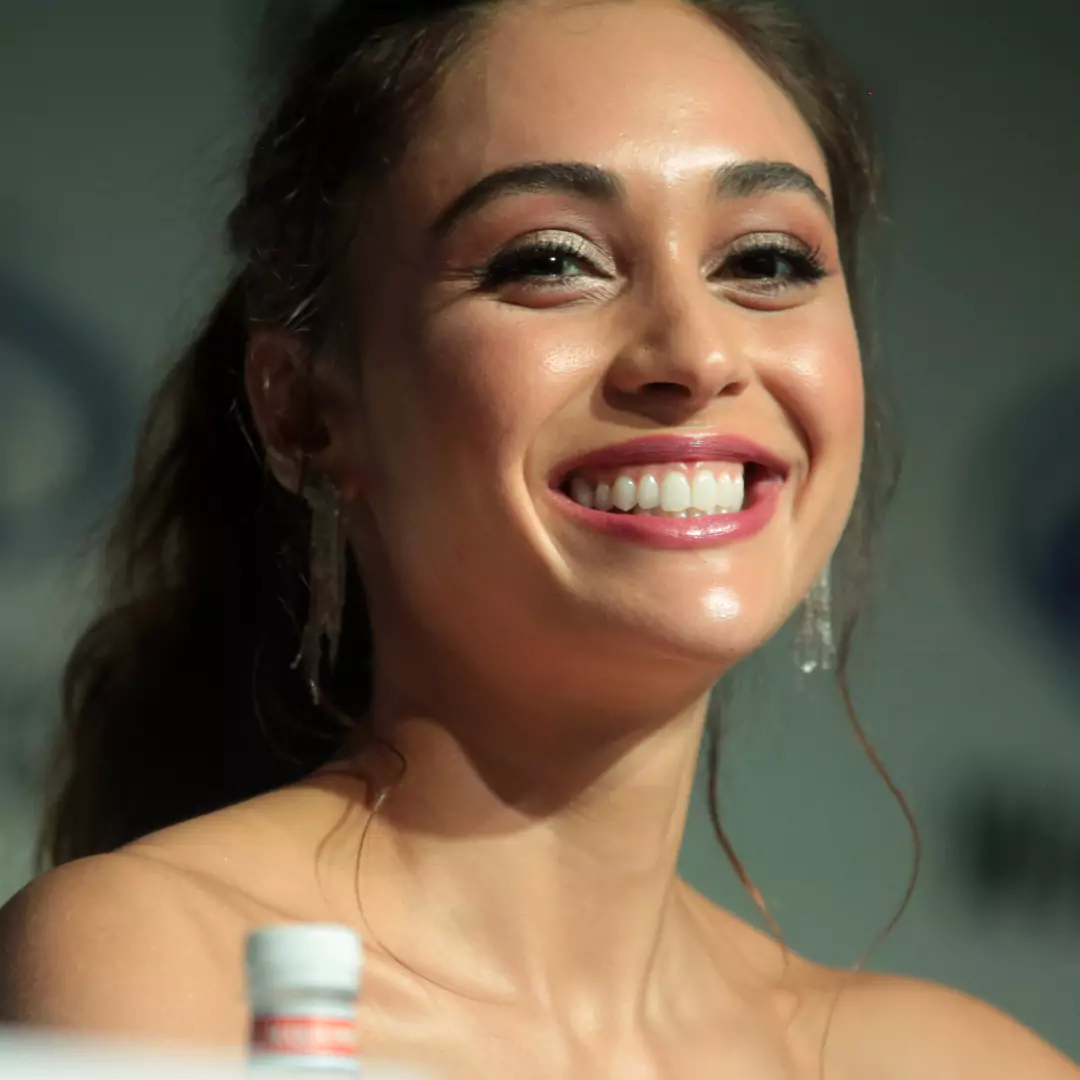 Lindsey Morgan smiling brightly at a public event, highlighting her career as an actress